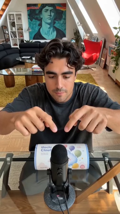 An ASMR unboxing shot with a studio microphone